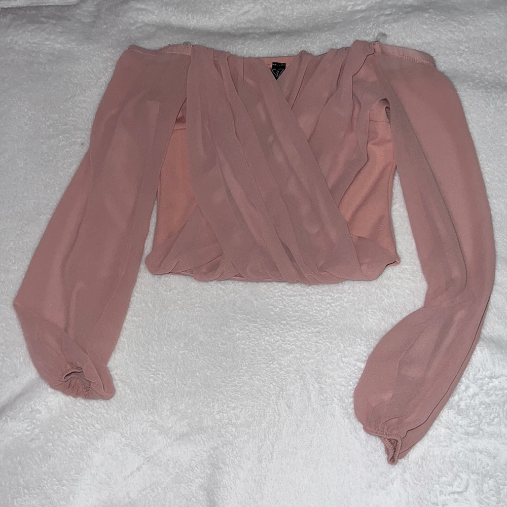 Windsor strapless pink top, with sheer sleeves.